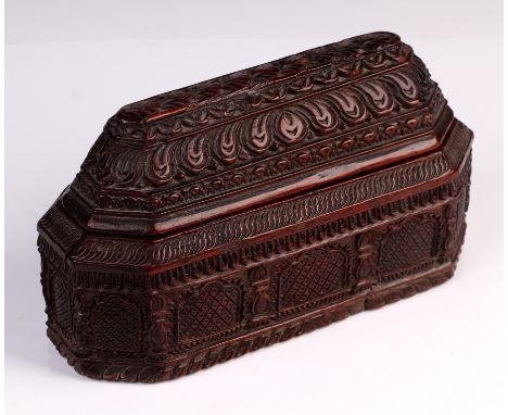 A 19th century Indo Persian architectural carved hardwood box and cover in the form of a elongated rectangular temple, 22cm l