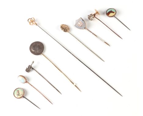 A Charles Horner 9ct gold hat pin, an 18ct gold white stone stick pin, a yellow metal opal stick pin together with other stic