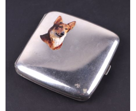 An early 20th century silver and enamel cigarette case, the cover with a portrait of a dog, stamped '935', 117g, 8cms wide.