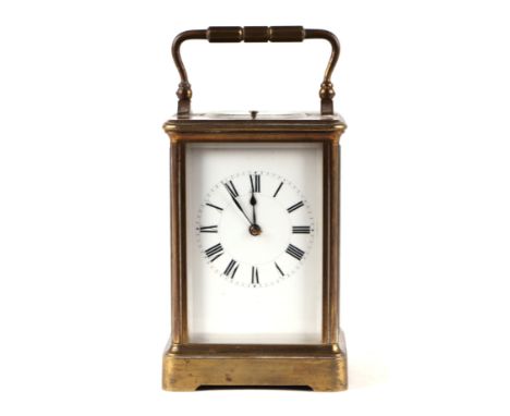 A French repeating carriage clock, the white enamel dial with Roman numerals, fitted an 8-day movement striking on a gong, in