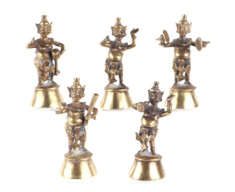 A set of five Nepalese / Indian cast brass temple figures playing various musical instruments, each approx 11cms high (5).