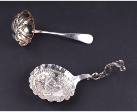 A George V silver caddy spoon with repousse decoration in the Dutch taste, Sheffield 1919, 24g; together with a late Victoria