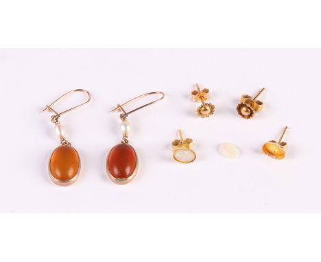 A pair of 9ct gold stud earrings; together with a pair of opal stud earrings and a pair of amber and pearl drop earrings.Cond