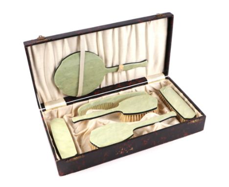 A faux jade bakerlite six pieced dressing table set, in  a faux tortoiseshell case. 
