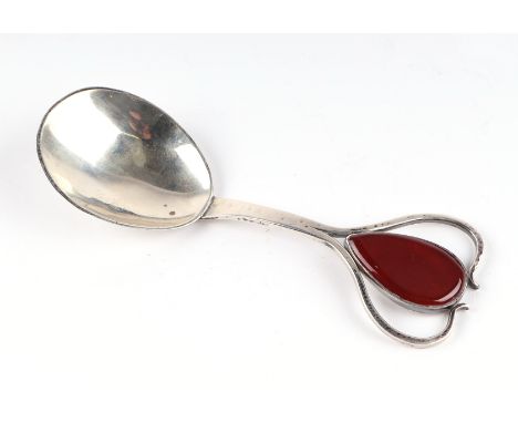 An Art Nouveau style carnelian set oversized silver caddy spoon, Birmingham 1977, makers mark HMN. 15cm long.Condition Report