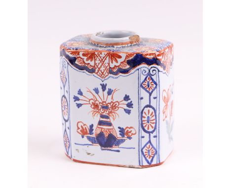 A Delft three-colour octagonal tea caddy decorated with flowers, 10cms high.