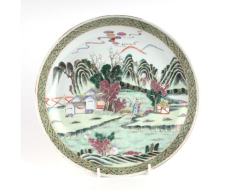 A Chinese famille vert shallow bowl decorated with figures in a landscape, 26cms diameter.Condition ReportThere is a hairline