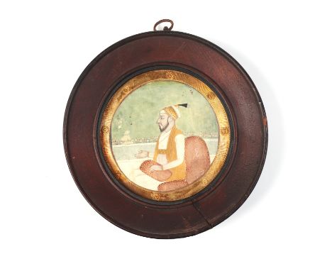 Indian school - a circular portrait depicting a Mughal Nobleman, possibly Aurangzeb and 18th century, watercolour, 7cms diame