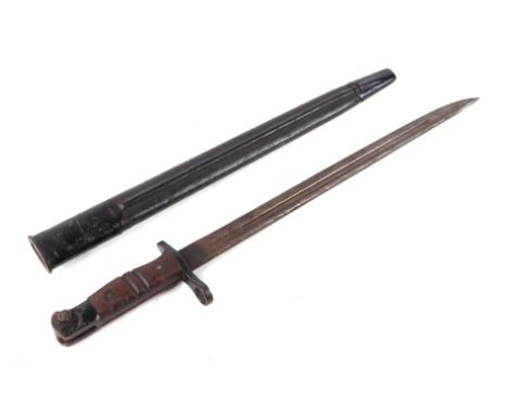 A WWI K bayonet with 42cms long double fuller steel blade with metal and leather scabbard.