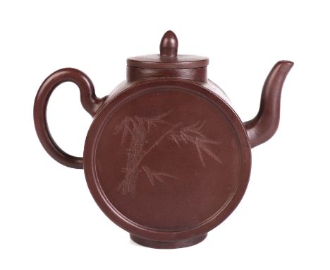 A Chinese Yixing pottery teapot decorated with bamboo, impressed seal mark to the underside, 14cms high.Condition Reportgood 