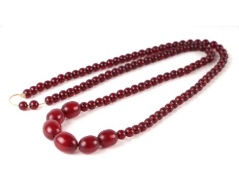 A cherry amber Bakelite graduated bead necklace (visible marbling to beads under light), 66g.