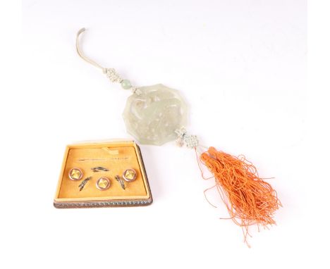 A Chinese pierced jade pendant decorated with a parrot amongst foliage; together with a boxed set of three rolled gold shirt 