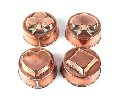 A set of four Victorian copper jelly moulds, each embossed with playing card suits, numbered F391, F392, F393 and F394, each 