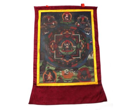 A Sino-Tibetan thangka mandala decorated with multiple figures and deities. 51 by 72cm