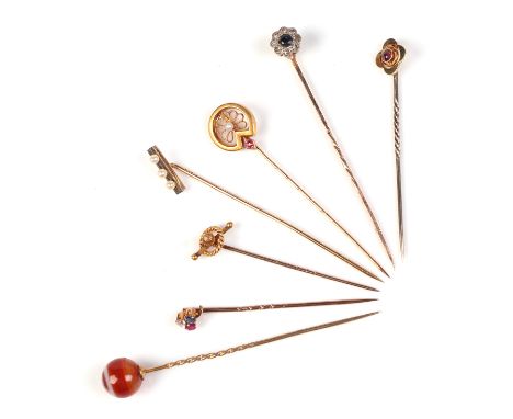 A quantity of Victorian and Edwardian yellow metal and gem set stick pins, 9.5g.