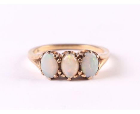 A 9ct gold three-stone opal ring, approx UK size 'M', 2.4g.