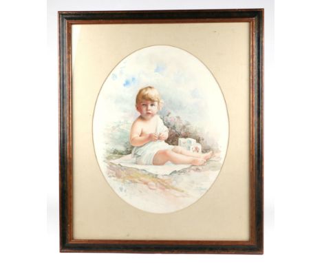 Elio Ximenes (1855-1926) - an oval portrait of a young child with building blocks, signed lower right, framed & glazed, water