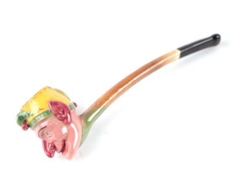 A Victorian novelty Mr Punch pottery pipe, 15cms long.