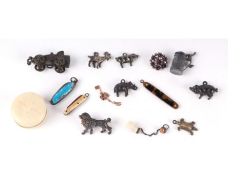 A group of antique miniature items to include an enamel penknife, a miniature key,  miniature animals and other items.