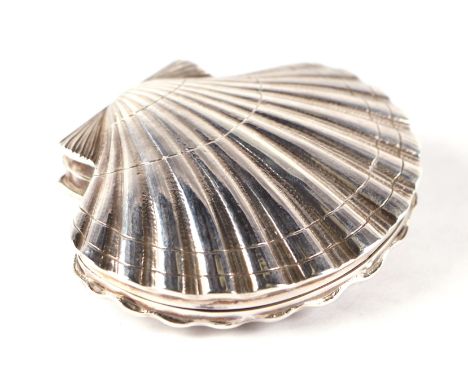 A novelty silver scallop shell form box, London 1950 and makers mark for Leslie Gordon Durbin, 8cm wide. Condition ReportGene