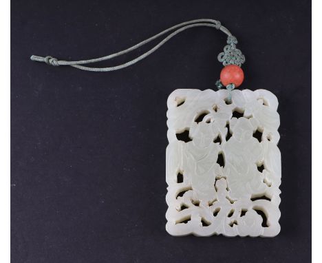 A Chinese pierced jade pendant, 5 by 6.5cms.