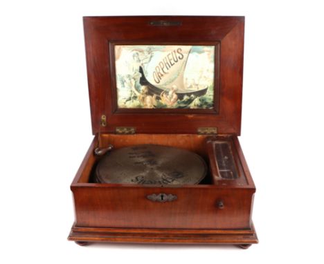 A 19th century Morpheus Polyphon in a walnut case, 46cms wide; together with six discs each 29.5cms wide.Condition ReportIn w