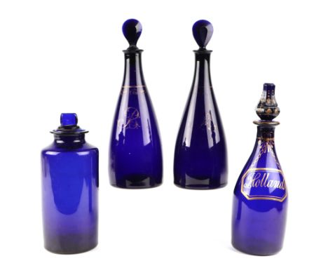 A 19th century gilded Bristol blue glass bottle labelled 'Hollands', 23cms high; together with a pair of Bristol blue decante