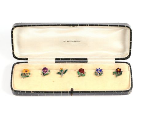 A cased set of gilt white metal and enamel cup markers, each fashioned as a different flower, with patent no. 14232.  Such ma