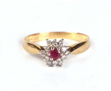 An 18ct gold diamond and ruby cluster ring, approx UK size 'M', 2.6g.