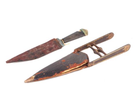 An Indian Katar fighting dagger with 16cms long ribbed steel blade, iron hilt with gilt highlights and leather scabbard; toge