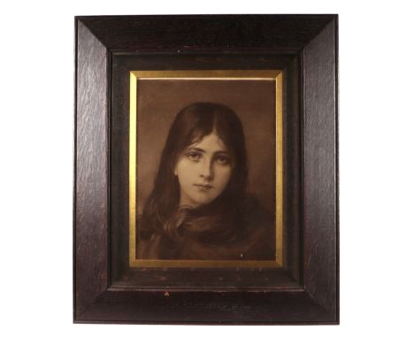 A sepia photographic print depicting a young girl, framed & glazed, 27 by 36cms.