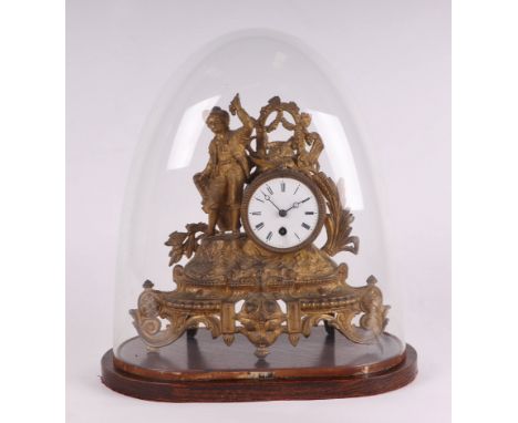 A 19th century French gilt spelter mantle clock, the white enamel dial with Roman numerals, under a glass dome, overall 41cms