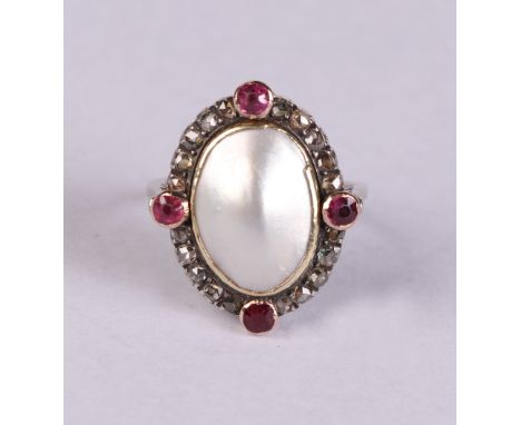 A white metal dress ring set with a central blister pearl surrounded by old cut diamonds and rubies, approx UK size 'M', 4.8g