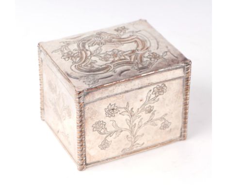 An 18th century Sheffield plate tea caddy with embossed and engraved decoration, 10cms wide.