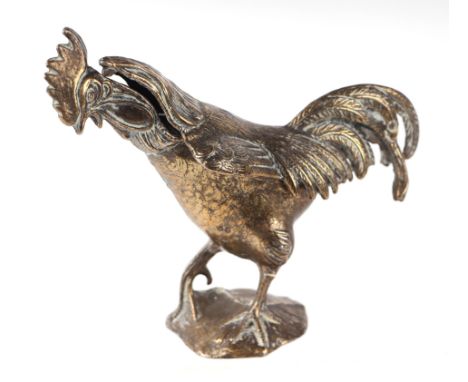 A cast gilt brass table top trinket box in the form of a crowing cockerel standing on a rock, approx 14cms high.