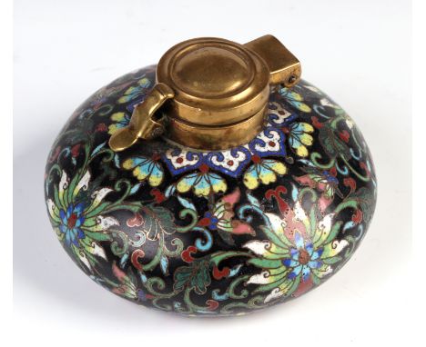 A Chinese cloisonné scholars inkwell, decorated flowers on a black ground, 9cm diameter Condition ReportThere is a dent and s