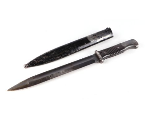 A WWII Third Reich Mauser bayonet. Double stamped on the pommel: WaA 883. Blade marked on ricasso: 41 cof & 9418i. With the s