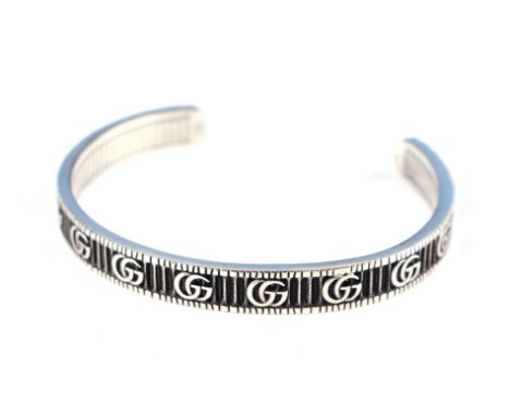 A Gucci silver bangle, 6.5cm wide, boxed weight 26.3g