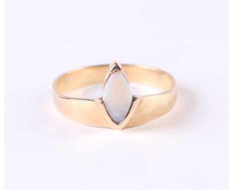 A yellow metal ring set with a navette shaped opal, approx UK size 'R', 3.3g.