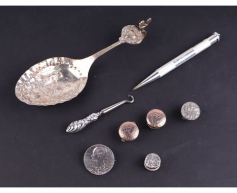 A group of silver items to include a caddy spoon, a propelling pencil, button hook, buttons and other similar items, various 