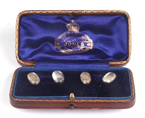 A pair of Victorian moonstone gold and silver mounted cufflinks. The cabochons are silver backed linked by a yellow metal(tes