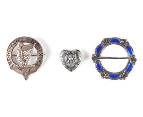 A silver clan badge for Rose Clan, a silver and enamel cloak clasp and a Scottish heart shaped brooch, 50g (3).