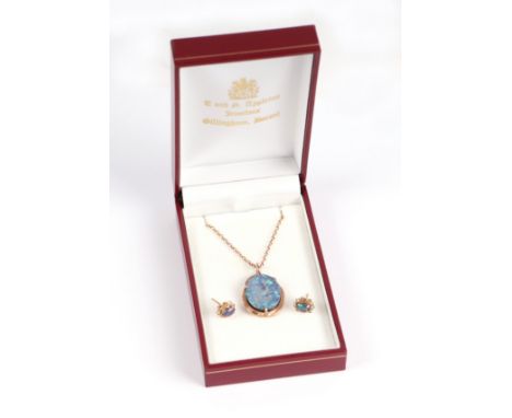 A 9ct gold mounted opal pendant on a 9ct gold chain with matching stud earrings, total weight 6.3g.
