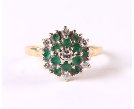 A gold (rubbed marks) emerald and diamond cluster ring,m approx UK size R, 3.8g.