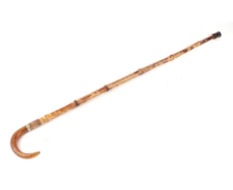 An early 20th century bamboo shafted sword stick with horn handle and having a square section tapering blade. Blade length 39