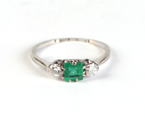 An 18ct white gold diamond and emerald trilogy ring, approx UK size 'I', 1.5g.Condition ReportThe shank is a little worn and 