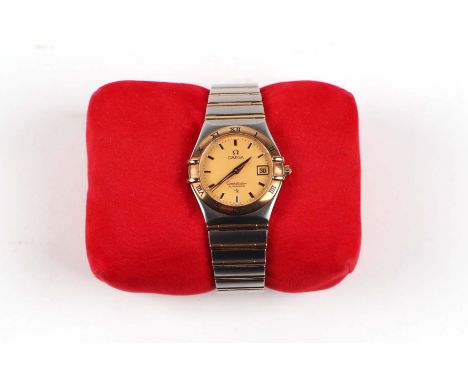A ladies Omega Constellation Automatic wristwatch, the champagne dial with dagger hands, centre seconds and date aperture, 28