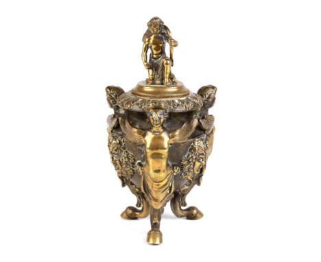 An 18th century style Italian bronze inkwell on tripod angel supports and Bacchus mask decoration having a Cupid finial, 16cm