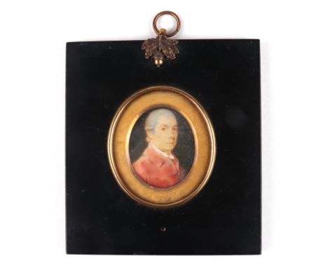 A 19th century oval portrait miniature on ivory depicting a gentleman wearing hunting reds, in an ebonised frame, portrait 3.