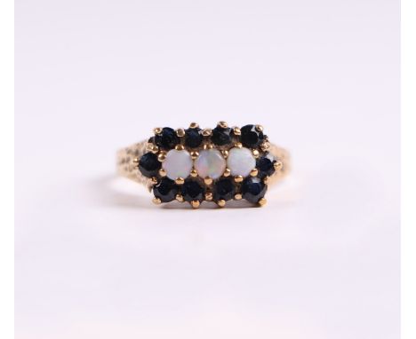 A 9ct gold opal and sapphire ring, approx UK size 'O', 2.8g.